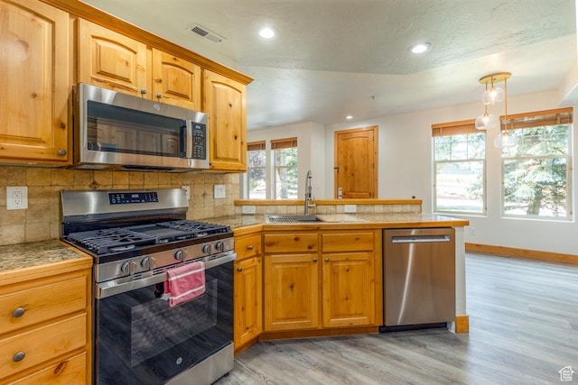 1746 W Redstone Ave # G, Park City, UT 84098 - kitchen featuring plenty of natural light, light hardwood / wood-style floors, sink, and appliances with stainless steel finishes