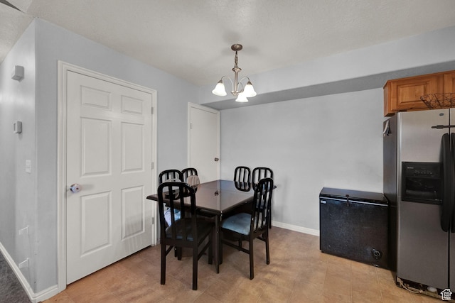 8246 N Cedar Springs Rd Unit 11, Eagle Mountain, UT 84005 - dining room featuring baseboards and a chandelier