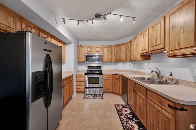 8246 N Cedar Springs Rd Unit 11, Eagle Mountain, UT 84005 - kitchen featuring a sink, light countertops, and appliances with stainless steel finishes