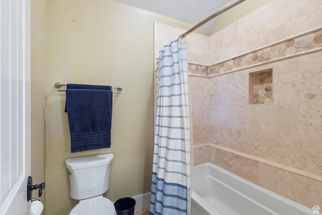 bathroom with toilet and shower / bath combo