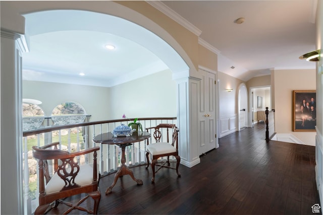 3880 E Thousand Oaks Cir, Salt Lake City, UT 84124 - corridor featuring dark wood finished floors, lofted ceiling, arched walkways, ornamental molding, and wainscoting
