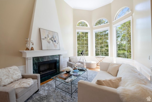 3880 E Thousand Oaks Cir, Salt Lake City, UT 84124 - living area with wainscoting, a healthy amount of sunlight, crown molding, and wood finished floors