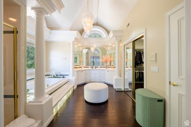 3880 E Thousand Oaks Cir, Salt Lake City, UT 84124 - full bathroom featuring a garden tub, hardwood / wood-style flooring, a shower stall, decorative columns, and vaulted ceiling