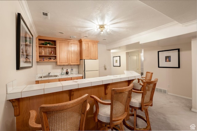 3880 E Thousand Oaks Cir, Salt Lake City, UT 84124 - kitchen featuring a sink, visible vents, tile counters, and freestanding refrigerator