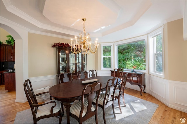 3880 E Thousand Oaks Cir, Salt Lake City, UT 84124 - dining room with arched walkways, wainscoting, a raised ceiling, light wood-type flooring, and a chandelier