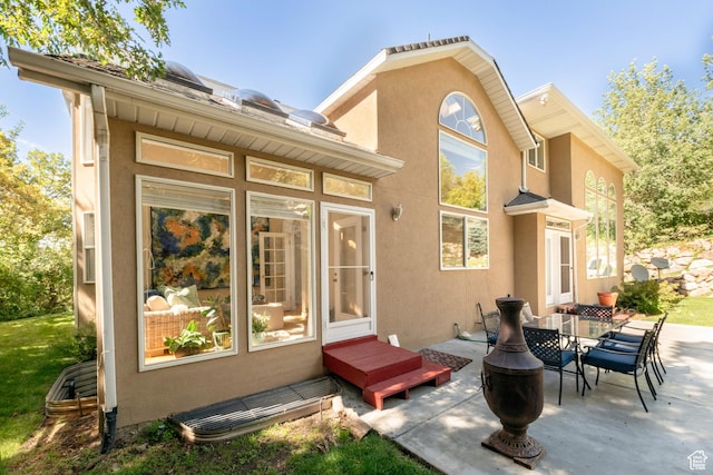 3880 E Thousand Oaks Cir, Salt Lake City, UT 84124 - rear view of property with a patio area and stucco siding