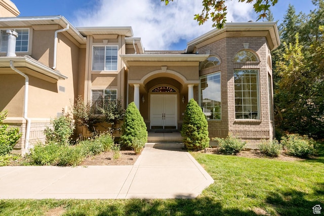 3880 E Thousand Oaks Cir, Salt Lake City, UT 84124 - property entrance featuring stucco siding and a yard
