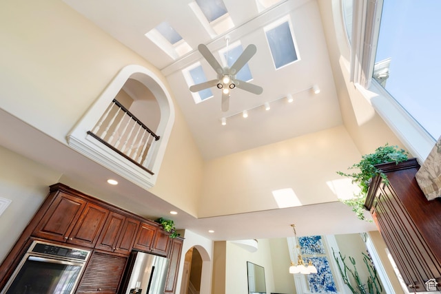 3880 E Thousand Oaks Cir, Salt Lake City, UT 84124 - room details with recessed lighting, arched walkways, track lighting, appliances with stainless steel finishes, and ceiling fan with notable chandelier