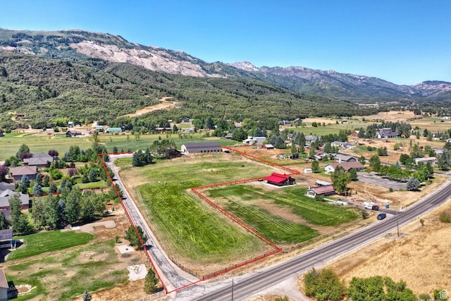 drone / aerial view featuring a mountain view and a rural view