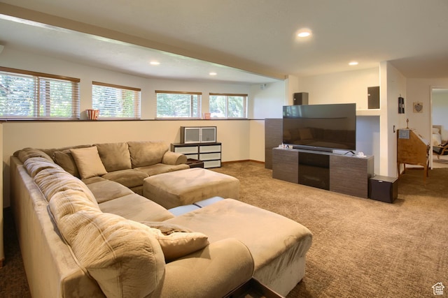 living area featuring baseboards, recessed lighting, carpet, and a healthy amount of sunlight