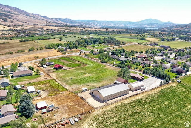 drone / aerial view featuring a mountain view and a rural view