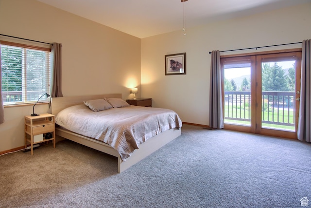 bedroom with carpet, access to outside, and baseboards