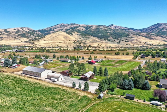 drone / aerial view with a mountain view and a rural view