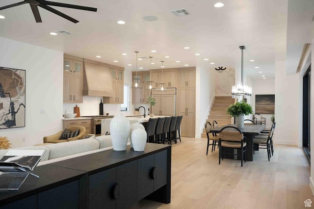 5346 Cyan Ln, St George, UT 84790 - kitchen with light wood-style flooring, custom exhaust hood, visible vents, and recessed lighting