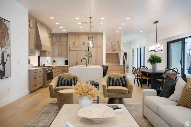 5346 Cyan Ln, St George, UT 84790 - living area featuring recessed lighting, stairway, light wood-style floors, a chandelier, and baseboards