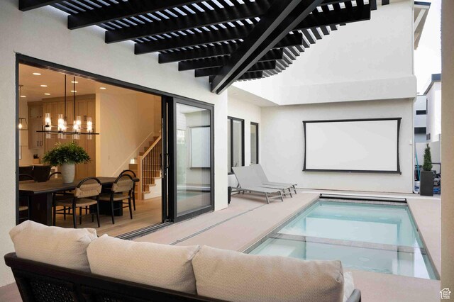 5346 Cyan Ln, St George, UT 84790 - view of pool featuring a chandelier and a pool with connected hot tub