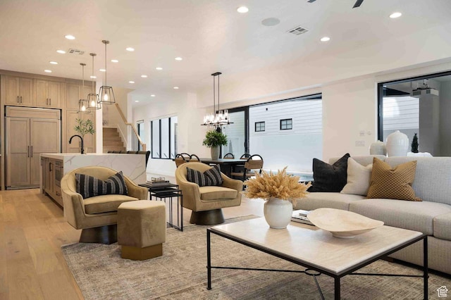 5346 Cyan Ln, St George, UT 84790 - living area with recessed lighting, visible vents, a notable chandelier, and light wood finished floors