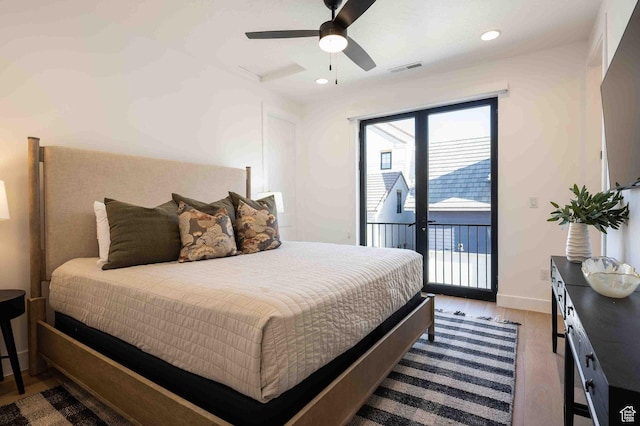 5346 Cyan Ln, St George, UT 84790 - bedroom with access to exterior, visible vents, attic access, a ceiling fan, and wood finished floors