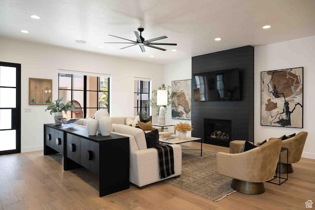 5346 Cyan Ln, St George, UT 84790 - living area featuring a fireplace, wood finished floors, and recessed lighting