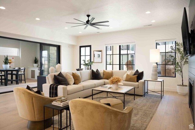 5346 Cyan Ln, St George, UT 84790 - living room with light wood-type flooring, a ceiling fan, and recessed lighting