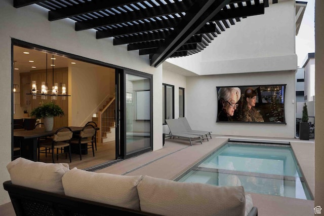 5346 Cyan Ln, St George, UT 84790 - view of swimming pool with a pool with connected hot tub and a notable chandelier