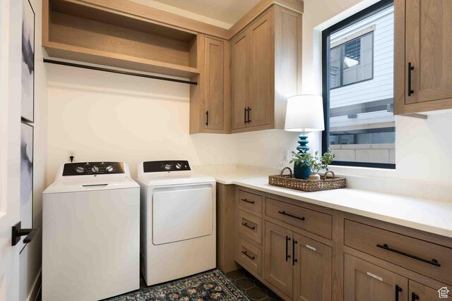 5346 Cyan Ln, St George, UT 84790 - washroom with cabinet space, dark tile patterned floors, and separate washer and dryer