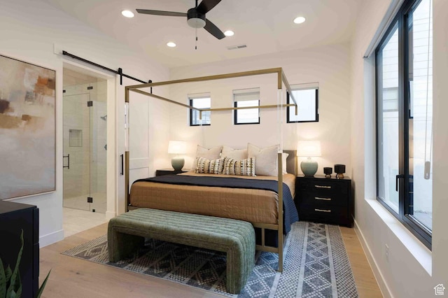 5346 Cyan Ln, St George, UT 84790 - bedroom with a barn door, baseboards, wood finished floors, and recessed lighting