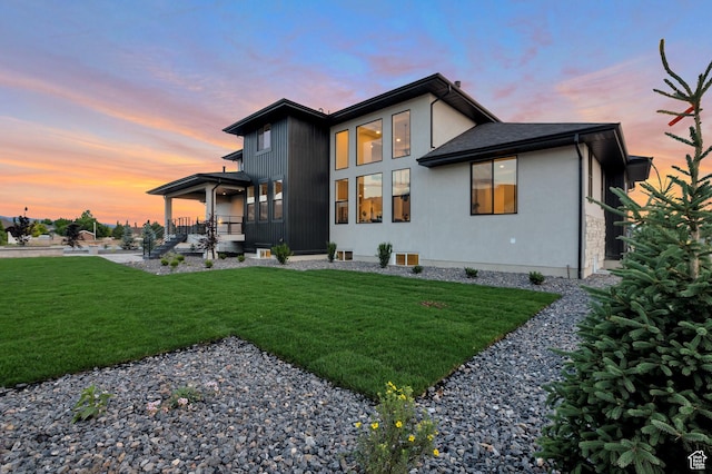 165 S Farmhouse Cir, Kaysville, UT 84037 - rear view of property featuring a yard and stucco siding