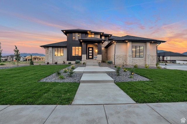 165 S Farmhouse Cir, Kaysville, UT 84037 - prairie-style house featuring stone siding, a front yard, and stucco siding
