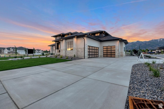165 S Farmhouse Cir, Kaysville, UT 84037 - view of front of property with a garage, stone siding, a yard, driveway, and stucco siding