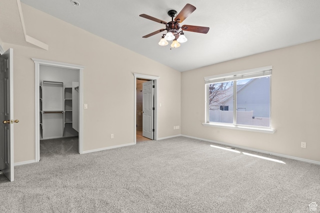 880 E 300 S, Smithfield, UT 84335 - unfurnished bedroom featuring carpet flooring, baseboards, vaulted ceiling, and a walk in closet
