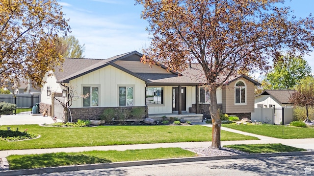 880 E 300 S, Smithfield, UT 84335 - view of front of house with a front lawn, board and batten siding, and fence