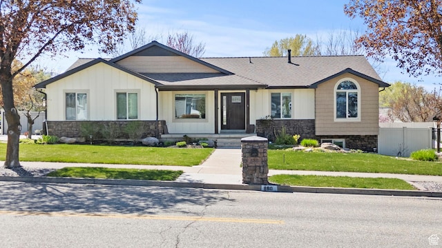 880 E 300 S, Smithfield, UT 84335 - view of front of house with a front lawn, board and batten siding, fence, and stone siding