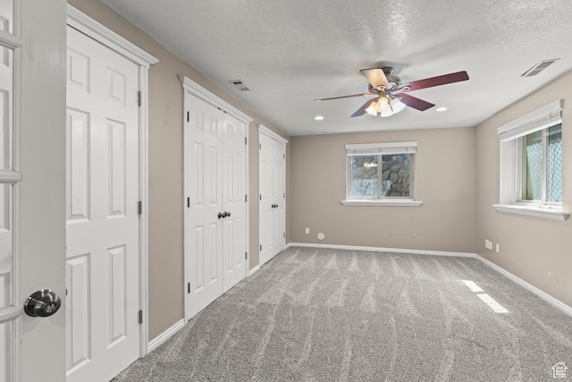 880 E 300 S, Smithfield, UT 84335 - unfurnished bedroom with visible vents, multiple closets, baseboards, and multiple windows