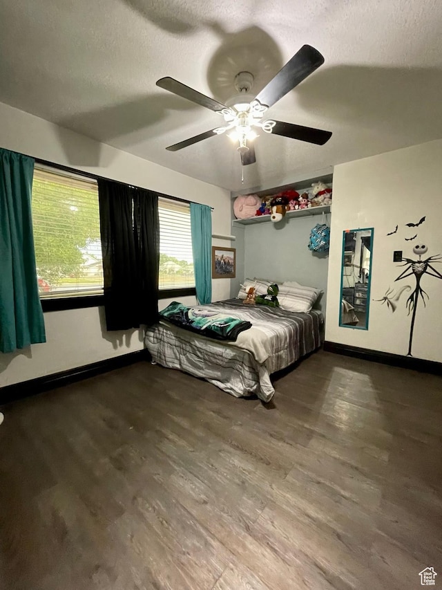 221 N 100 E, Price, UT 84501 - bedroom with baseboards, a textured ceiling, wood finished floors, and a ceiling fan