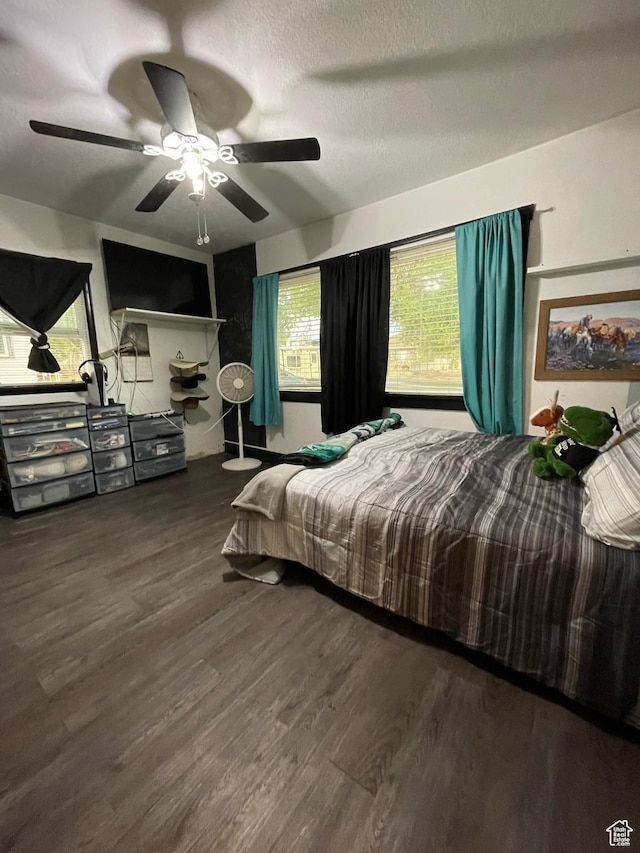 221 N 100 E, Price, UT 84501 - bedroom with wood finished floors and ceiling fan
