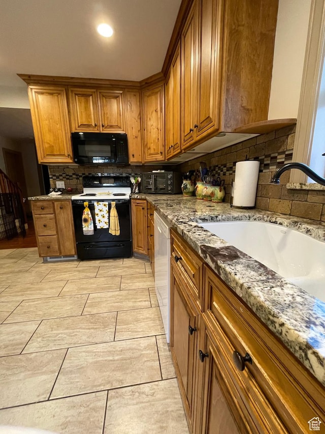 221 N 100 E, Price, UT 84501 - kitchen with black microwave, range with electric cooktop, a sink, brown cabinetry, and backsplash