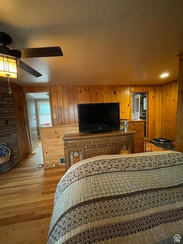 221 N 100 E, Price, UT 84501 - bedroom with wood walls and light wood-type flooring