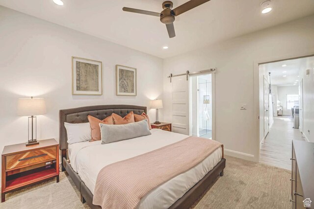 1240 E Villa Way Unit 64, Washington, UT 84780 - bedroom with light carpet, a barn door, baseboards, a ceiling fan, and recessed lighting