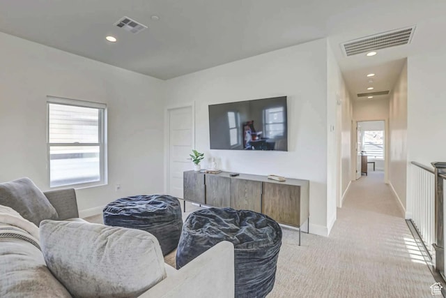 1240 E Villa Way Unit 64, Washington, UT 84780 - living area featuring light carpet, baseboards, and visible vents