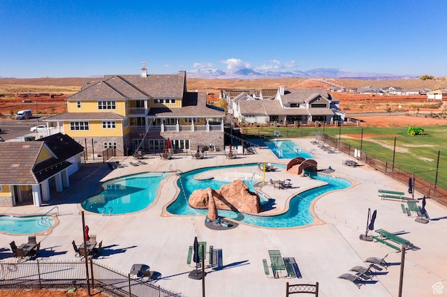 1240 E Villa Way Unit 64, Washington, UT 84780 - pool with a patio area, fence, and a mountain view