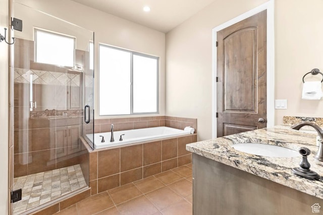 3193 S 4900 W, Hurricane, UT 84737 - full bathroom featuring a stall shower, a garden tub, a wealth of natural light, and tile patterned floors