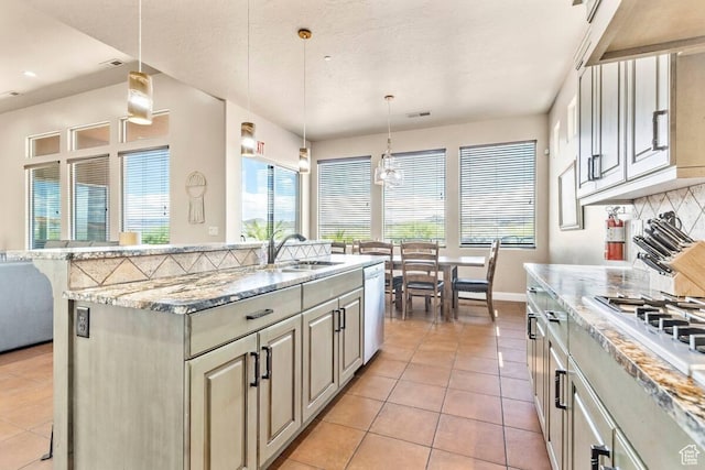 3193 S 4900 W, Hurricane, UT 84737 - kitchen featuring white gas stovetop, tasteful backsplash, dishwasher, a sink, and light tile patterned flooring