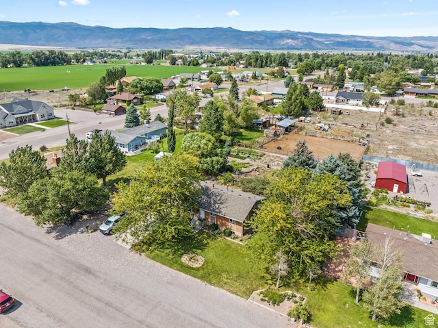 drone / aerial view featuring a residential view and a mountain view
