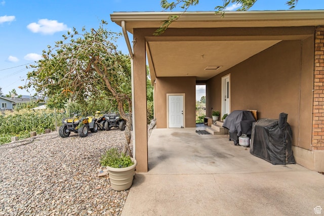 view of patio featuring a grill