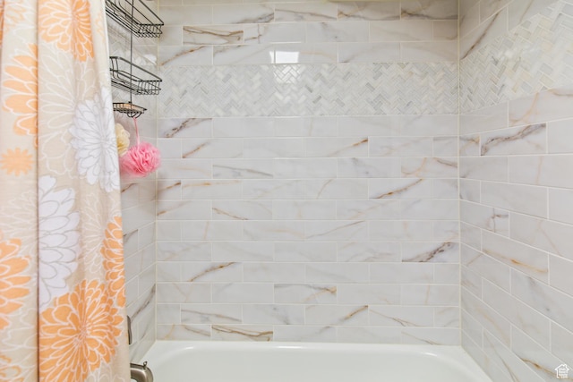 bathroom with shower / tub combo
