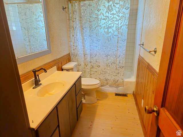 674 N 6th St, Montpelier, ID 83254 - full bathroom with shower / bath combo, hardwood / wood-style floors, toilet, and vanity