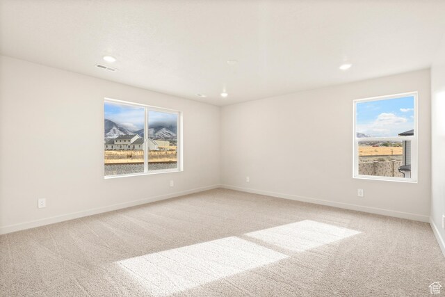 1264 N Berra Blvd Unit 133, Tooele, UT 84074 - spare room with visible vents, a healthy amount of sunlight, and light carpet