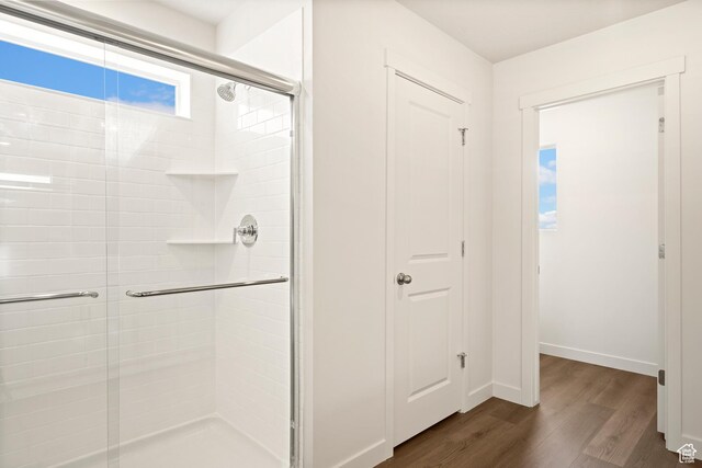 1264 N Berra Blvd Unit 133, Tooele, UT 84074 - bathroom with baseboards, a stall shower, and wood finished floors