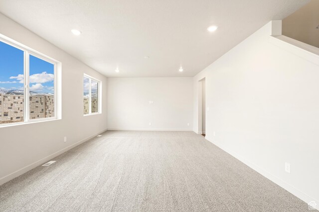 1264 N Berra Blvd Unit 133, Tooele, UT 84074 - spare room featuring recessed lighting, baseboards, and light colored carpet